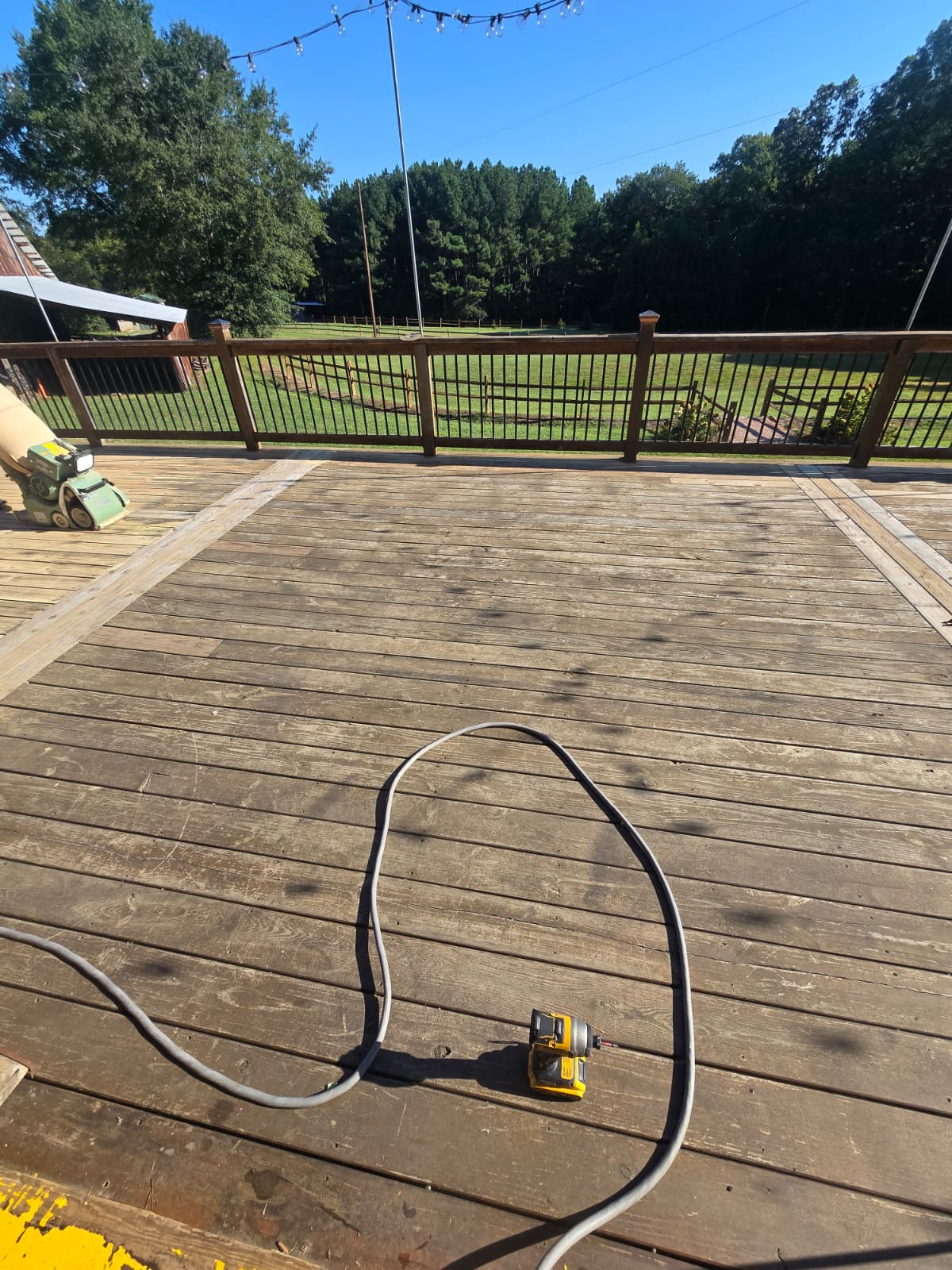 Weathered outdoor wood deck before professional sanding and restoration